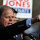 Then-Democratic senatorial candidate Doug Jones speaks to reporters after voting at Brookwood Baptist Church in Mountain Brook, Ala., on Dec. 12, 2017. (Justin Sullivan/Getty Images)